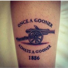 a tattoo that reads, once a gooner always a gooner 1876 on the leg