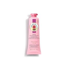 a tube of hand cream on a white background with pink and gold trimmings