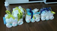 three diapers are stacked on top of each other in the shape of a baby carriage