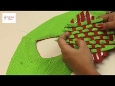 a person is working on an object made out of woven material