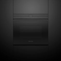 two ovens side by side on a black background