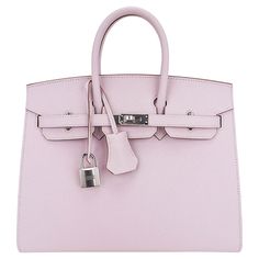 Mightychic offers anHermes Birkin Sellier 25 bag featured in gorgeous soft Mauve Pale. Perfectly complimented with Palladium hardware. This exquisite bag is modern and minimalist. A sleek pared down version that exudes chic sophistication. Epsom leather with the signature sellier edges create a work or art. Comes with the lock and keys in the clochette, sleepers, signature Hermes box. NEW or NEVER WORN. final sale BAG MEASURES: LENGTH 25 cm / 9.75" TALL 18.5 cm / 7.25" DEEP 13 cm / 5.25" HANDLES: TALL 3" CONDITION: NEW or NEVER WORN Hermes Large Bag, Hermes Mauve Pale, Purses Vintage, Vintage Designer Bags, Random Ideas