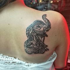 a woman with a tattoo on her back