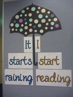 a bulletin board with words and an umbrella