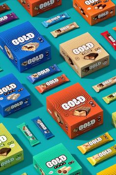 an array of colorful candy bars on a blue surface with the words good written in them