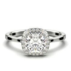 a round cut diamond ring with halos on the sides