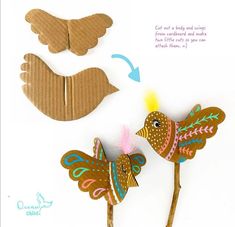 the paper bird is made from cardboard and has feathers on it