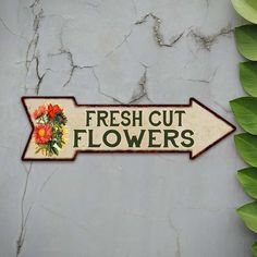 a sign that says fresh cut flowers on it