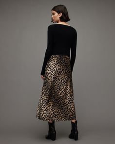 Mix and match with your mood. The Hera Leppo Dress features a detachable cropped jumper over a leopard print slip dress - layering made easy.     2-in-1 Dress Midi length 90s-inspired Adjustable straps Leopard print  Jumper Long sleeve Split cuffs Ribbed     Regular fit Model is 5'10" / 178cm and is wearing size Medium  Knit portion: 71% Lenzing™ EcoVero™ viscose, 29% polyester Woven portion: 60% recycled polyester, 36% polyester, 4% elastance Machine wash inside out LENZING™ ECOVERO™ has a much Allsaints Outfit, All Saints Clothing, Slip Dress Layering, Dress Layering, Print Slip Dress, Cami Slip Dress, Wings Dress, Cropped Jumper, 21st Dresses