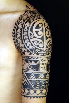 a man's arm with an intricate tattoo design on the back of his body