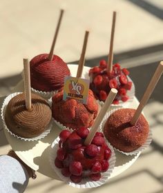 there are many desserts on the plate and one is red with strawberries in it