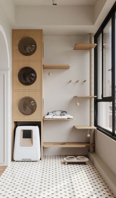 a kitchen with black and white tile flooring next to a shelf filled with dishes