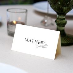 a place card sitting on top of a table