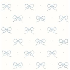 a white wallpaper with blue bows on it