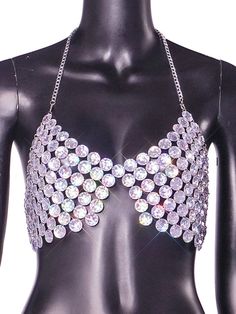 a black mannequin with lots of crystal stones on it's chest and back