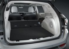 the interior of a car with its trunk open