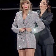 two women in short shorts and boots on stage