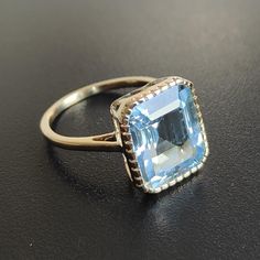 This stunning ring is set in 14k Solid Yellow Gold with Natural Sky Blue Topaz with utmost precision. It is an unique statement gemstone ring for nearly every occasion and is completely hassle-free jewelry. ITEM DETAILS * GEM: Sky Blue Topaz * GEM SIZE: 10X12mm * GEM SHAPE: Octagon * GEM WEIGHT: 7.15 carats * Gold Purity: 14KT * Gold Weight: 2.27 gram * Total Weight of the Ring: 3.70 gram The Gold purity is guaranteed and it comes with authentic 14KT gold hallmark. Since my items are handmade, t Sky Blue Topaz Engagement Ring, Sky Blue Topaz Ring, Gold Skies, Natural Sky, Blue Topaz Jewelry, Handmade Jewelry Box, Topaz Jewelry, Sky Blue Topaz, Alternative Engagement Rings