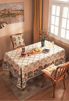 a dining room with a table and chairs