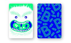 two playing cards with an image of a monster on the front and back, both in blue