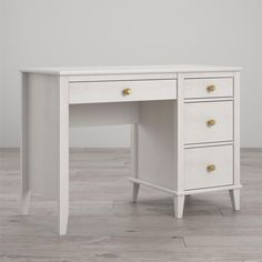 a white desk sitting on top of a hard wood floor