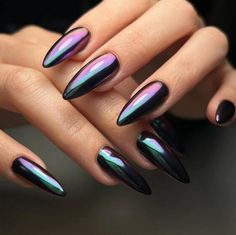 a woman's hand with black and purple nails