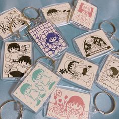 several key chains with cartoon images on them