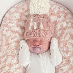 What a cute way to greet the world! This beanie is hand knit in cozy Rosy pink hued yarn with the word 'hi.' in natural colored yarn. Topped with a natural yarn pom pom, this looks great with everything and is a fun gender neutral baby gift.• 100% Acrylic• Cold handwash• Hand knit in China Girls Beanie Hats, Girls Knit Hat, Neutral Baby Gifts, Newborn Hats, Girl Beanie, Yarn Pom Pom, Cozy Hat, Crochet Girls, Rosy Pink