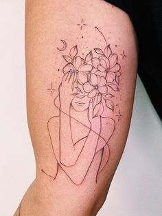 a woman's thigh with flowers and stars on her left side, in the shape of a heart