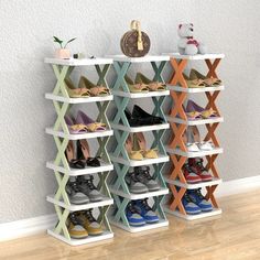 an organized shoe rack in the corner of a room