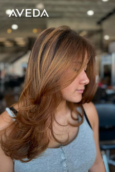 @gracieseabolt.aveda's honey brown hair color is a 10 out of 10! These golden highlights perfectly frame this layered, face-framing haircut. Ready to recreate the look? Tap to book you Aveda Color transformation today. #AvedaArtist #AvedaColor #Brunette #LayeredHaircut #HoneyBrown Warm Tone Highlights, Framing Haircut, Tone Highlights, Honey Brown Hair Color, Golden Highlights, Honey Brown Hair, Brown Hair Color