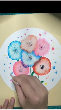 an image of flowers painted on a glass plate with sparkles in the back ground
