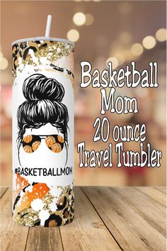a white and orange tumbler with the words basketball mom 20 ounce travel tumbler