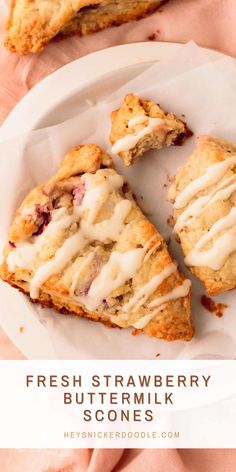 fresh strawberry buttermilk scones on a white plate with a pink napkin in the background