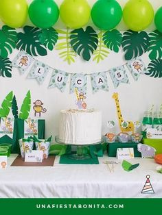 a jungle themed birthday party with green and white decorations