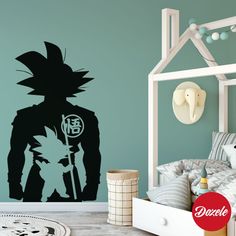 a bedroom with a wall decal that has the silhouette of a character from dragon ball