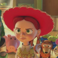 an animated character in a red hat surrounded by toy animals
