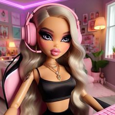 a barbie doll with headphones on sitting in front of a keyboard