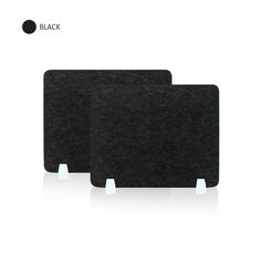 two black placemats sitting next to each other on top of a white surface