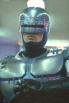 a man in a futuristic suit and helmet
