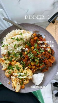 a plate filled with rice and vegetables on top of a table