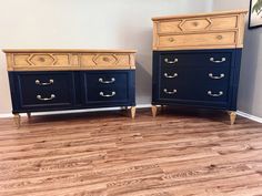 two blue dressers sitting on top of a hard wood floor next to each other