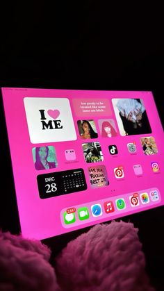 a pink computer screen with various icons on it