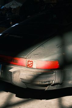 the back end of a parked car in a parking lot