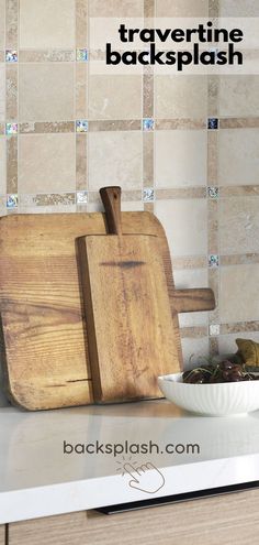 a wooden cutting board sitting on top of a counter next to a bowl and knife