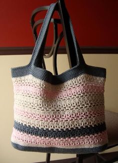 a crocheted bag sitting on top of a chair