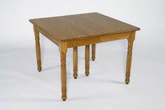 a small wooden table with two legs and a drawer on the top, against a white background