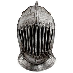 an old helmet with metal spikes on the side and two rows of teeth attached to it