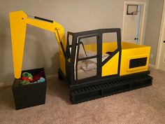 there is a construction truck bed in the room