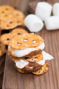some cookies and marshmallows are stacked on top of each other